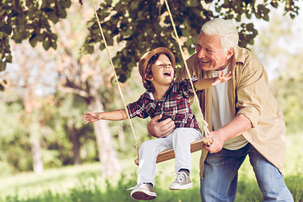 grandson and grandpa swinging