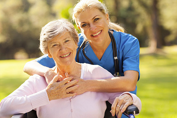 nurse and patient holding hands