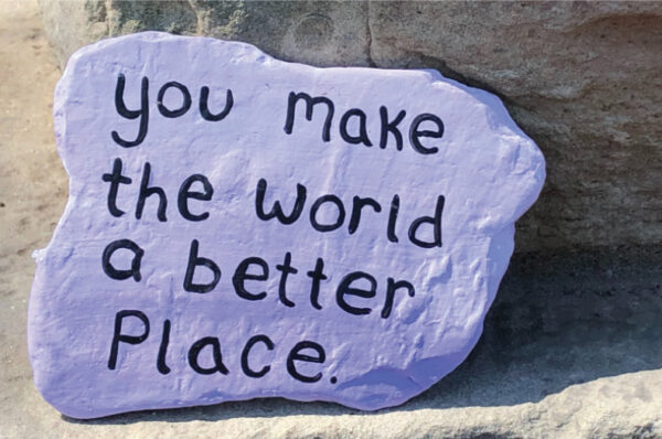 purple stone rock with wording: you make the world a better place.